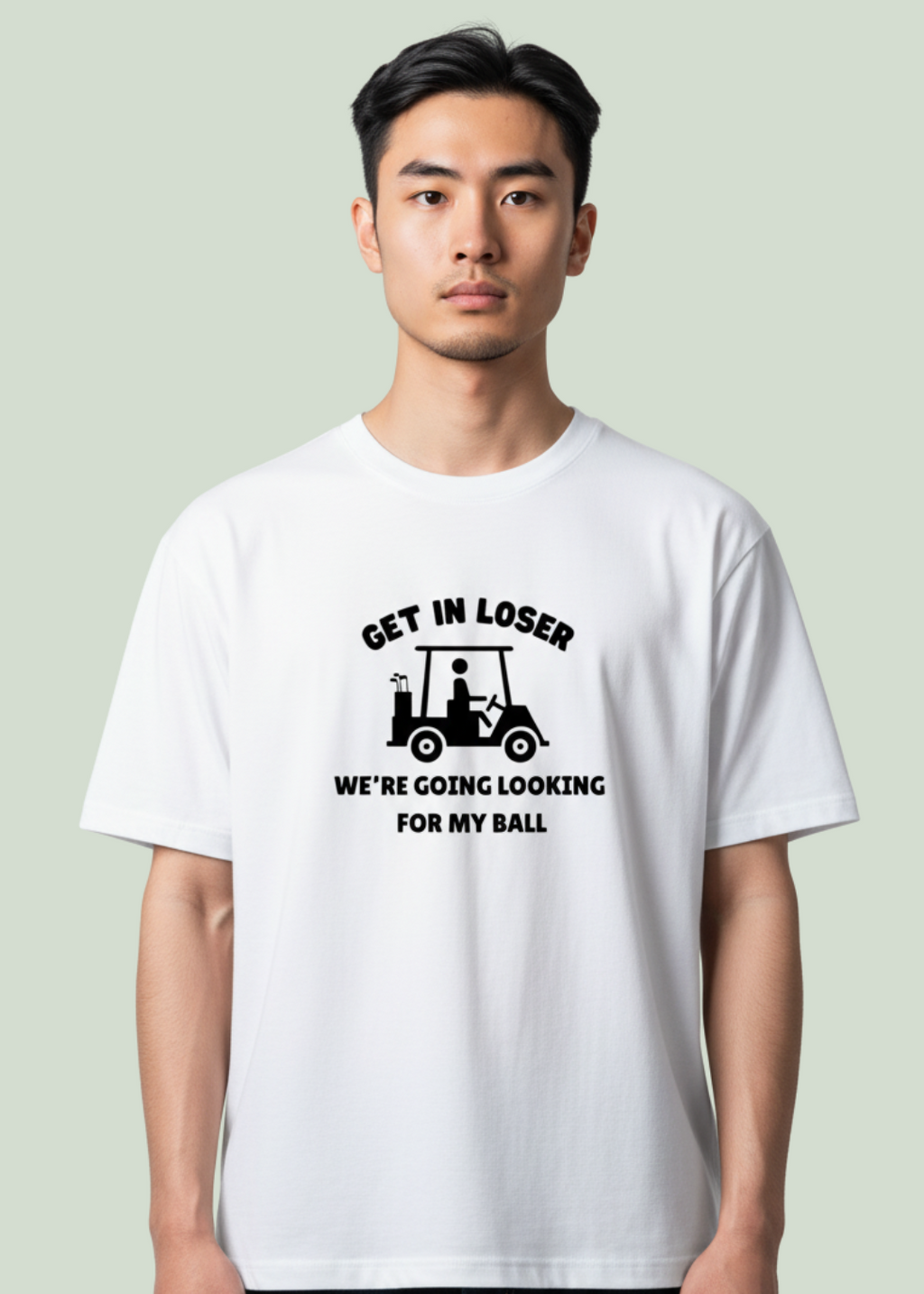 Person wearing a white t-shirt with humorous text design on a plain background